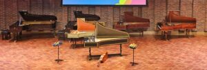 A stage with a wood floor and a brick back wall with two grand pianos and two harpsichords set out