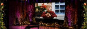 An AI image of McCauley Culkin on the big screen in the Turner Sims auditorium